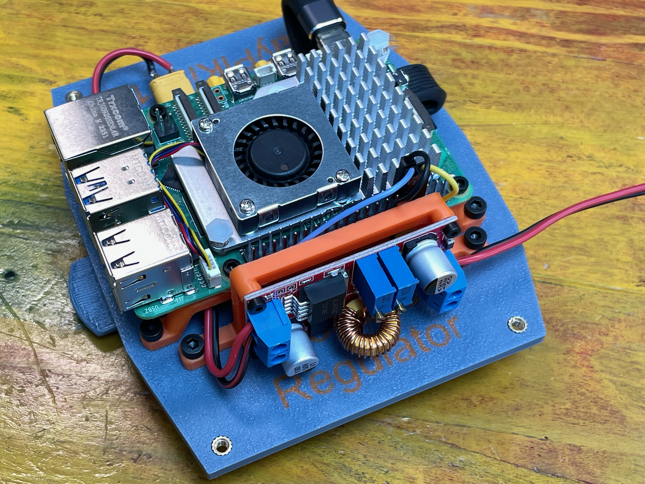 Voltage Regulator Assembly Secured to Plate